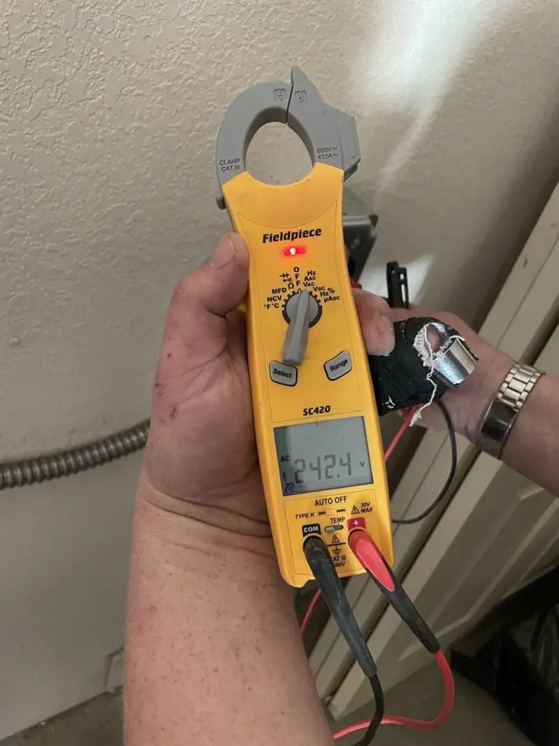 Voltage testing with clamp meter during Outlet Installation in Parkersburg